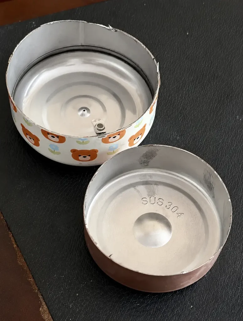 SUS 304 stainless steel cup material inspection showing stamped steel grade
