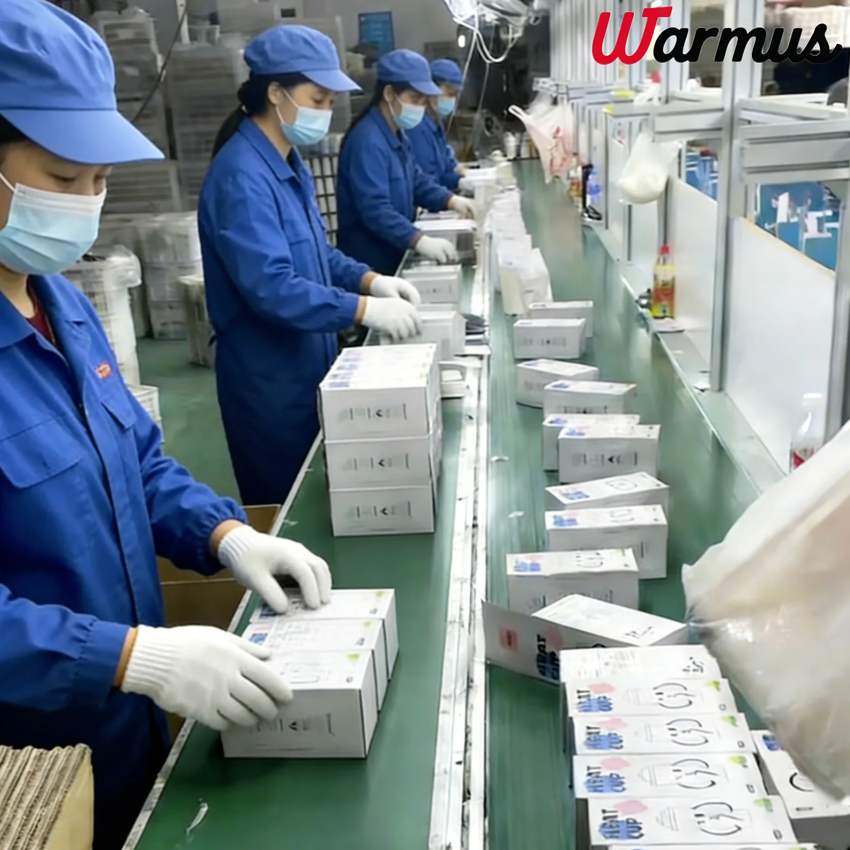Warmus workers packing insulated drinkware on the production line